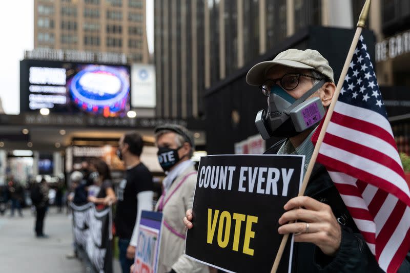 Voters line up to cast ballots on the first day of early voting in New York