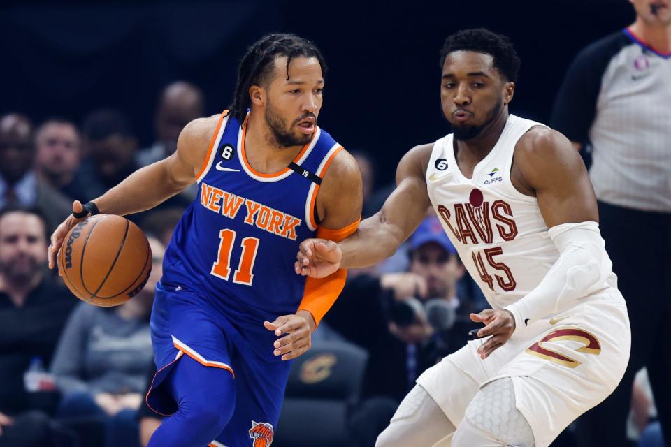 New York Knicks guard Jalen Brunson (11) drives against Cleveland Cavaliers guard Donovan Mitchell (45) during the first half on March 31.
