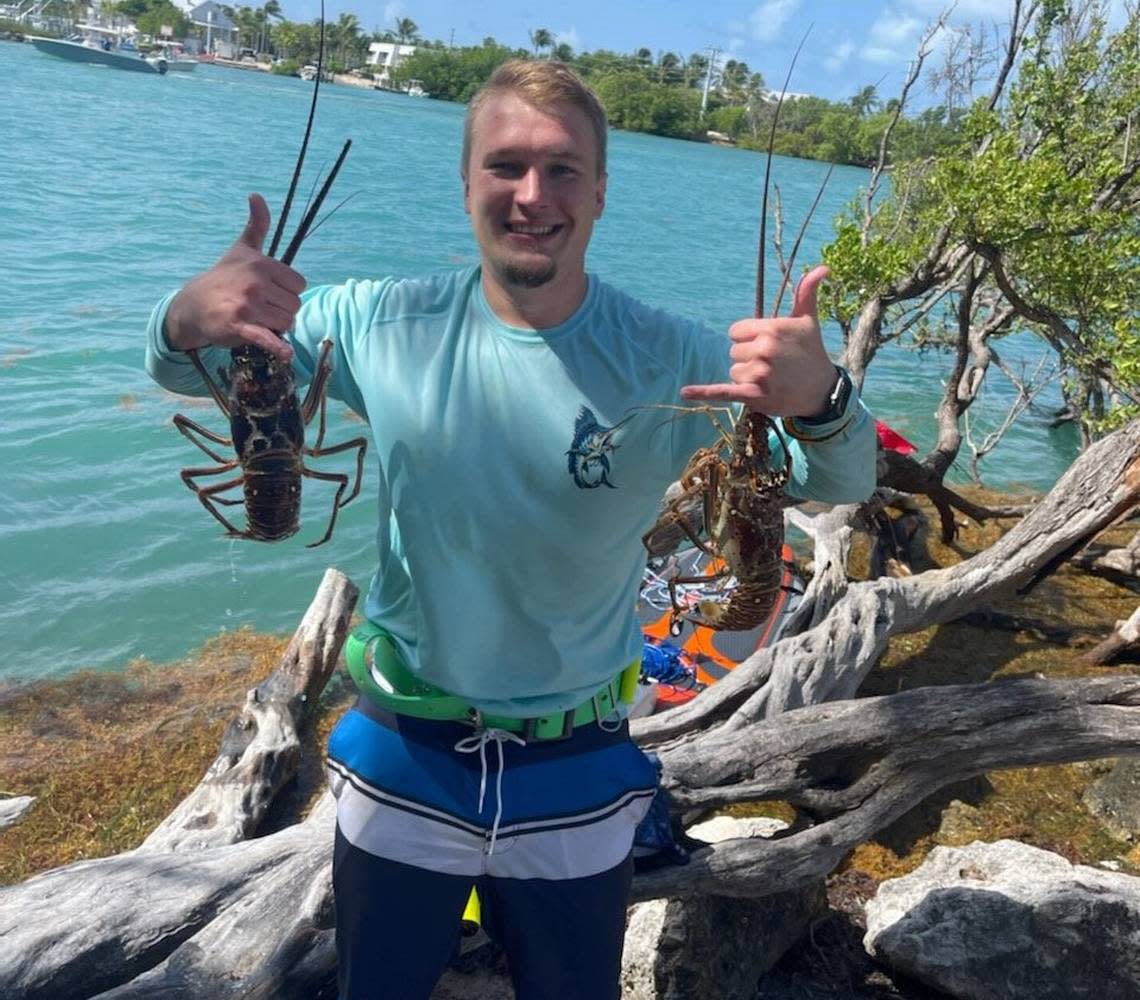 A lobster hunter shows off his catch in the Florida Keys during the 48-hour lobster miniseason event Florida holds every year in advance of the regular lobster season.