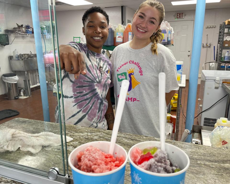 From left: Pelican's SnoBalls team members Mikayla Penn and Caroline Scoggins chill behind the counter in Athens.