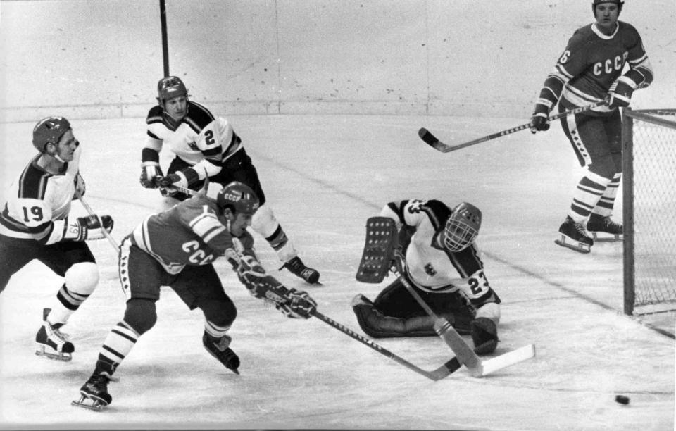 FILE - A Feb. 10, 1976 photo from files showing the Soviet Union's Vladimir Petrov, second left, scoring a goal during the XII Winter Olympic Games Men's Ice Hockey group B match against West Germany, in Innsbruck, Austria. Petrov, a two-time Olympic hockey champion who was on the Soviet Union team that lost to the United States at the 1980 Lake Placid Games, died Tuesday. He was 69. Petrov played alongside Boris Mikhailov and Valery Kharlamov on an offensive line considered one of the best in hockey history. (AP Photo/File)