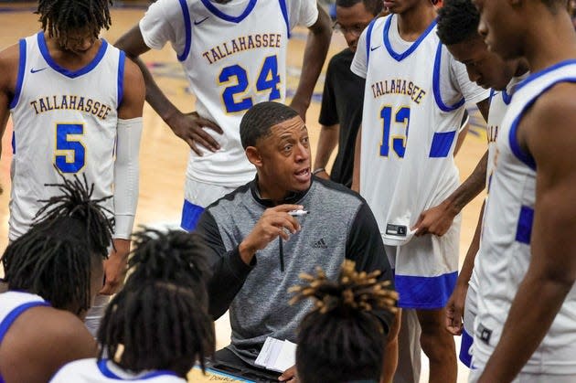 Tallahassee Community College men's basketball coach Rick Cabrera coaches his team during a timeout at the Bill Hebrock Eagledome in Tallahassee, Florida
