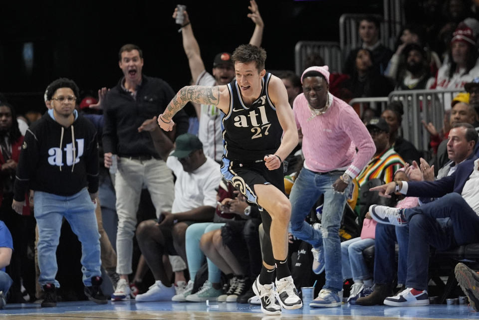 Atlanta Hawks guard Vit Krejci (27) runs up the court after hitting a three-point basket during the second half of an NBA basketball game against the Boston Celtics Monday, March 25, 2024, in Atlanta. (AP Photo/John Bazemore)