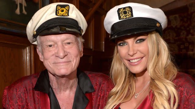 Hugh and Crystal Hefner dress up at the mansion.