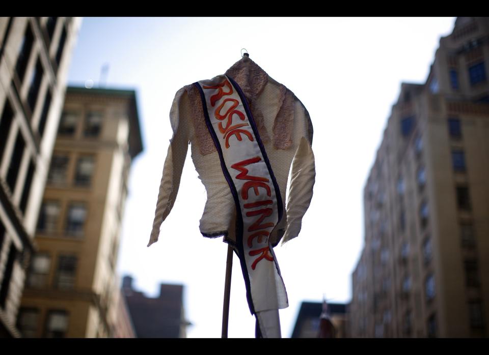 NEW YORK - MARCH 25:  A shirt bearing the name of a victim is held at a ceremony at the site of theTriangle Shirtwaist Factory fire March 25, 2011 in New York City. The ceremony marked the 100 year anniversary of the fire which killed 146 immigrant workers, most of them young women. Workers were locked into the factory during their shifts, preventing escape. New Yorkers watched in horror from below as workers leapt to their deaths from the windows above. Public outcry over the tragedy led to nationwide debate on workers rights and safety regulations and helped pave the way for strong workers unions. (Photo by Eric Thayer/Getty Images)