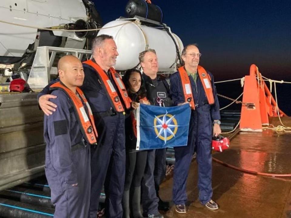 Renata Rojas, centre, poses with members of her July 2022 dive down to the wreckage of Titanic (Renata Rojas)