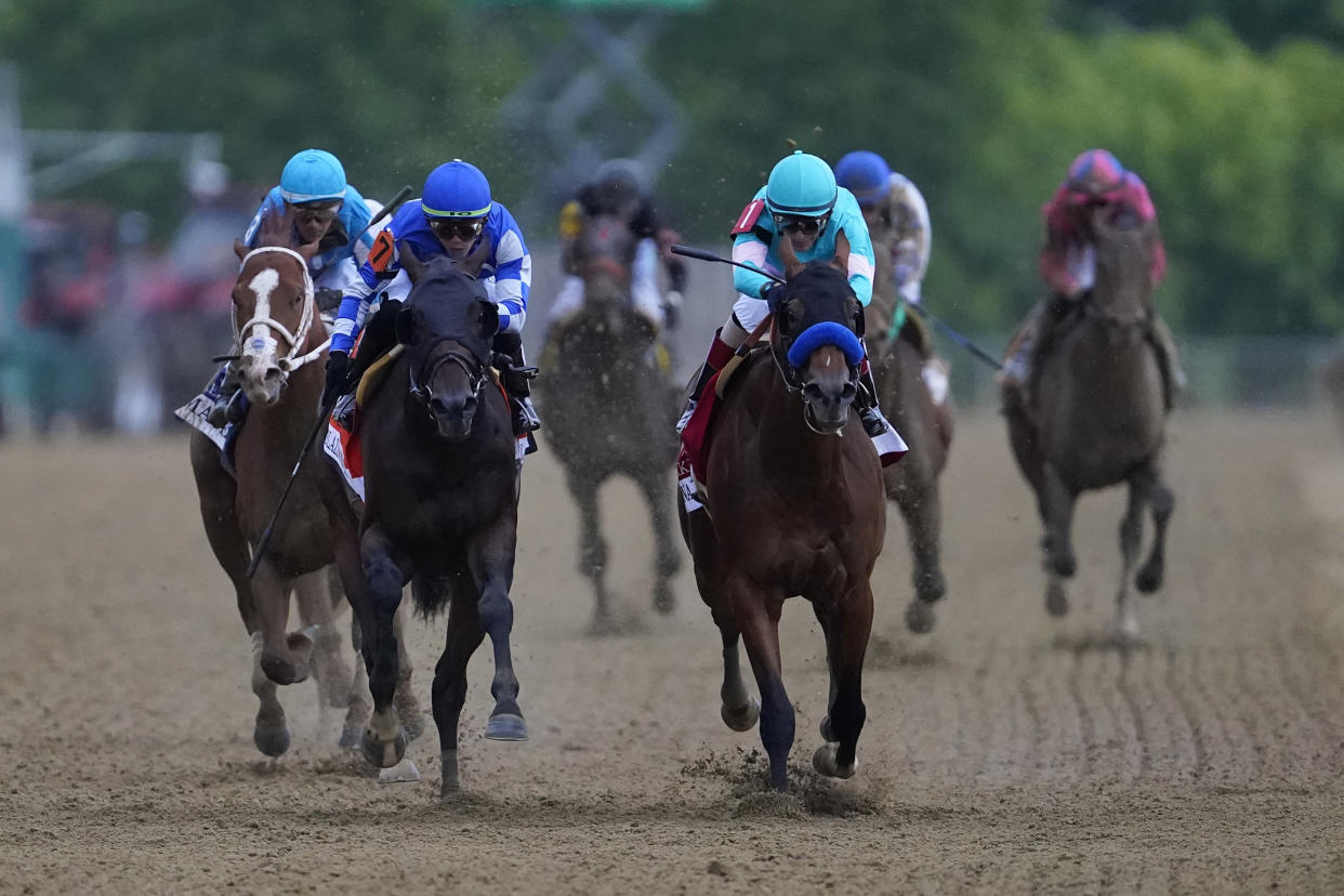 John Velazquez, right, atop National Treasure, and Irad Ortiz Jr., atop Blazing Sevens, compete down the final stretch during the148th running of the Preakness Stakes horse race at Pimlico Race Course, Saturday, May 20, 2023, in Baltimore. (AP Photo/Nick Wass)