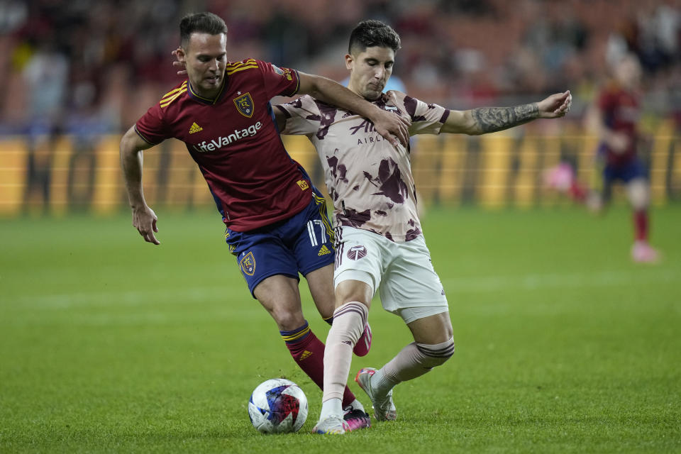 Real Salt Lake forward Danny Musovski (17) and Portland Timbers defender Claudio Bravo, right, compete for the ball during the second half of an MLS soccer match Wednesday, May 17, 2023, in Sandy, Utah. (AP Photo/Rick Bowmer)