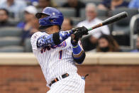 New York Mets' Jonathan Villar (1) hits an RBI single during the third inning in the first baseball game of a doubleheader against the Miami Marlins, Tuesday, Sept. 28, 2021, in New York. (AP Photo/Frank Franklin II)