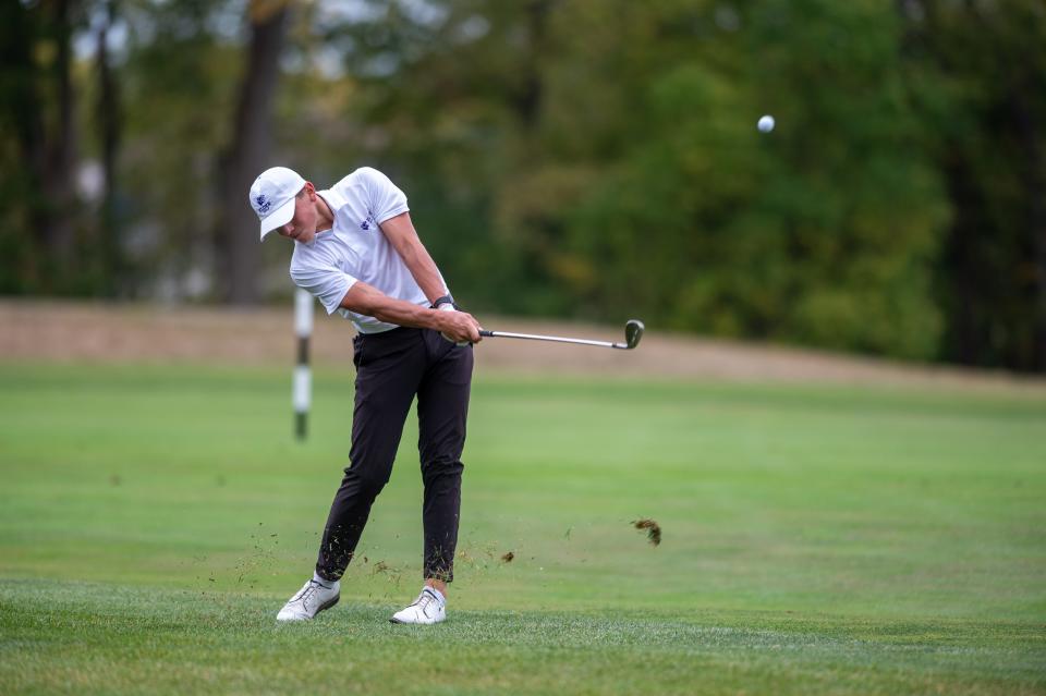 Cayse Morgan of Elder hits an approach shot during the Greater Catholic League-South golf tournament Monday, Sept. 25, 2023, at Heatherwoode Golf Club in Springboro, Ohio.