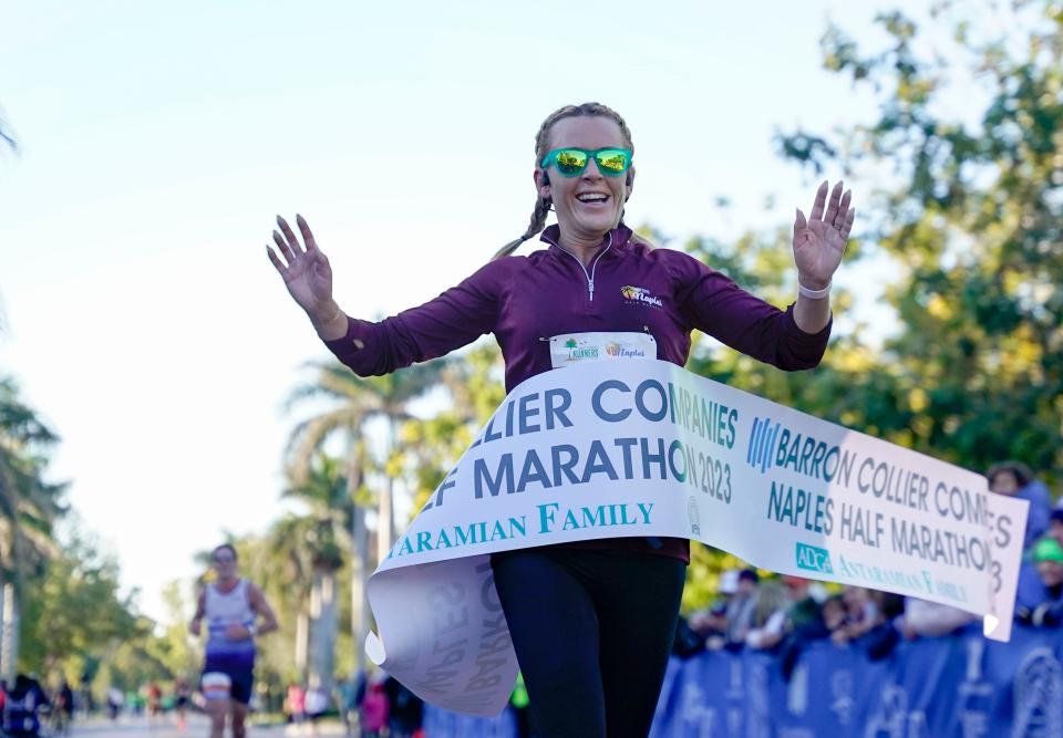 Stephanie Muscat of Grand Rapids, Michigan, finishes and takes first in the female division during the Barron Collier Companies Naples Half Marathon in Naples on Sunday, Jan. 15, 2023.