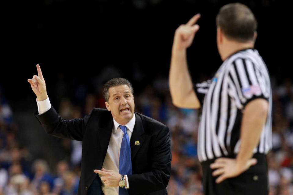 Head coach John Calipari of the Kentucky Wildcats reacts along with the referee in the first half against the Kansas Jayhawks in the National Championship Game of the 2012 NCAA Division I Men's Basketball Tournament at the Mercedes-Benz Superdome on April 2, 2012 in New Orleans, Louisiana. (Photo by Ronald Martinez/Getty Images)