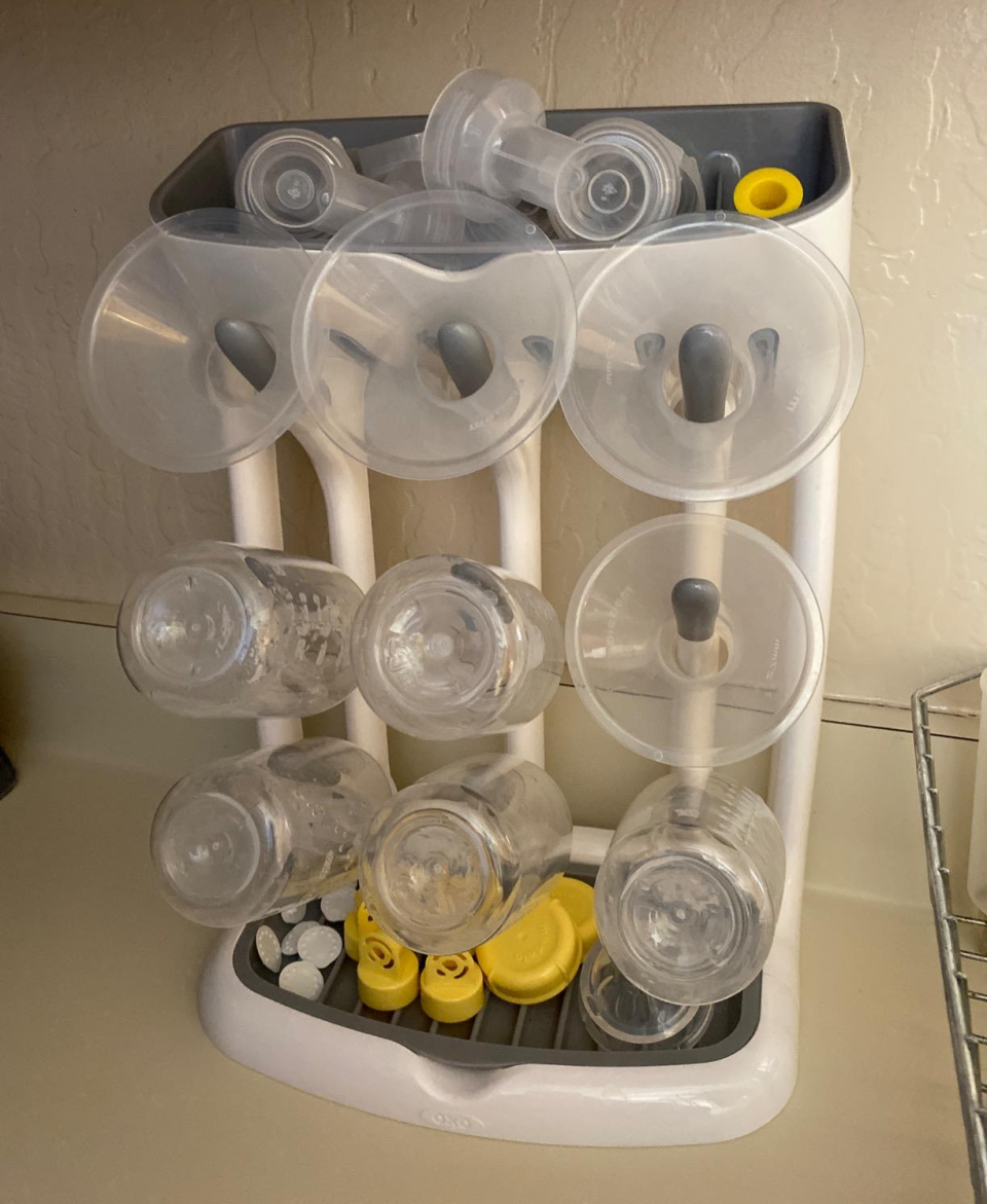 reviewer image of the vertical drying rack filled with baby bottle products