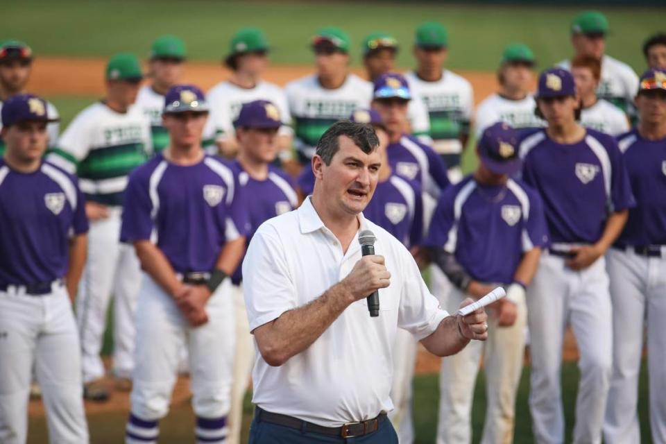 Chris Combs speaks to the crowd between games with players from Leesville Road and Broughton behind him during the Chris Combs ALS Classic at NCSU on Thursday, April 20, 2017.