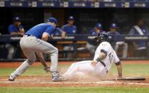 Jun 11, 2018; St. Petersburg, FL, USA; Tampa Bay Rays catcher Wilson Ramos (40) slides safely into home plate as Toronto Blue Jays relief pitcher John Axford (77) attempted to tag him out during the seventh inning at Tropicana Field. Mandatory Credit: Kim Klement-USA TODAY Sports