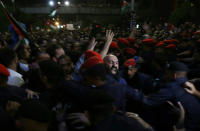 <p>Jordanian security forces scuffle with protesters attempting to breach the area as they stand guard during a demonstration outside the prime minister’s office in the capital Amman late on June 3, 2018. (Photo: Khalil Mazraawi/AFP/Getty Images) </p>