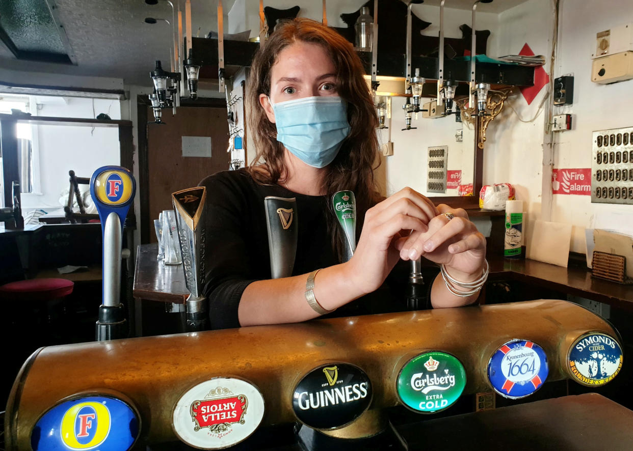 **EMBARGOED UNTIL 2PM BST / JULY 1, 2021**

Publican Jemima Burke at the bar of the Castle Inn, Dover.  A brazen thief caught on camera stealing £5,000 worth of gear in Dover couldn't be nicked because he had left England by going through customs and was waiting for a ferry to France.  See SWNS story SWNNburglar.  The Italian committed the 'perfect crime' by raiding a pub and driving into a Channel ferry port - a few hundred yards away.  Once there, he couldn't be arrested - by Dover cops or the gendarme - despite being pointed out by the enraged victim.  He was deemed to be on French soil - while the burglary had been committed on British soil.  The bearded suspect, a 31 year old called Luca is understood to have arrived safely home in Italy.  Publican Jemima Burne, 29, was tipped off about the daylight raid by builders working at the Castle Inn.  He timed it to coincide with his hasty departure. He calmly strolled into the bar helping himself to a rare guitar, an amp and a variety of other goods.  He was caught on CCTV around 1pm on June 9 loading his swag into a dark blue Peugeot - and made off. But furious Jemima tracked him down - into the nearby terminal. 