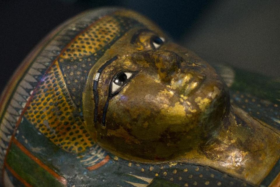 The Mummy of Tamut, a temple singer around 900 BC, is shown during a press conference at the British Museum in London, Wednesday April 9, 2014. Scientists at the British Museum have used CT scans and volume graphics software to go beneath the bandages, revealing the skin, bones, internal organs, and in one case a brain-scooping rod left inside a skull by embalmers. The results are going on display in an exhibition which sets eight of the museum's mummies alongside detailed 3-D images of their insides. (AP Photo/Alastair Grant)