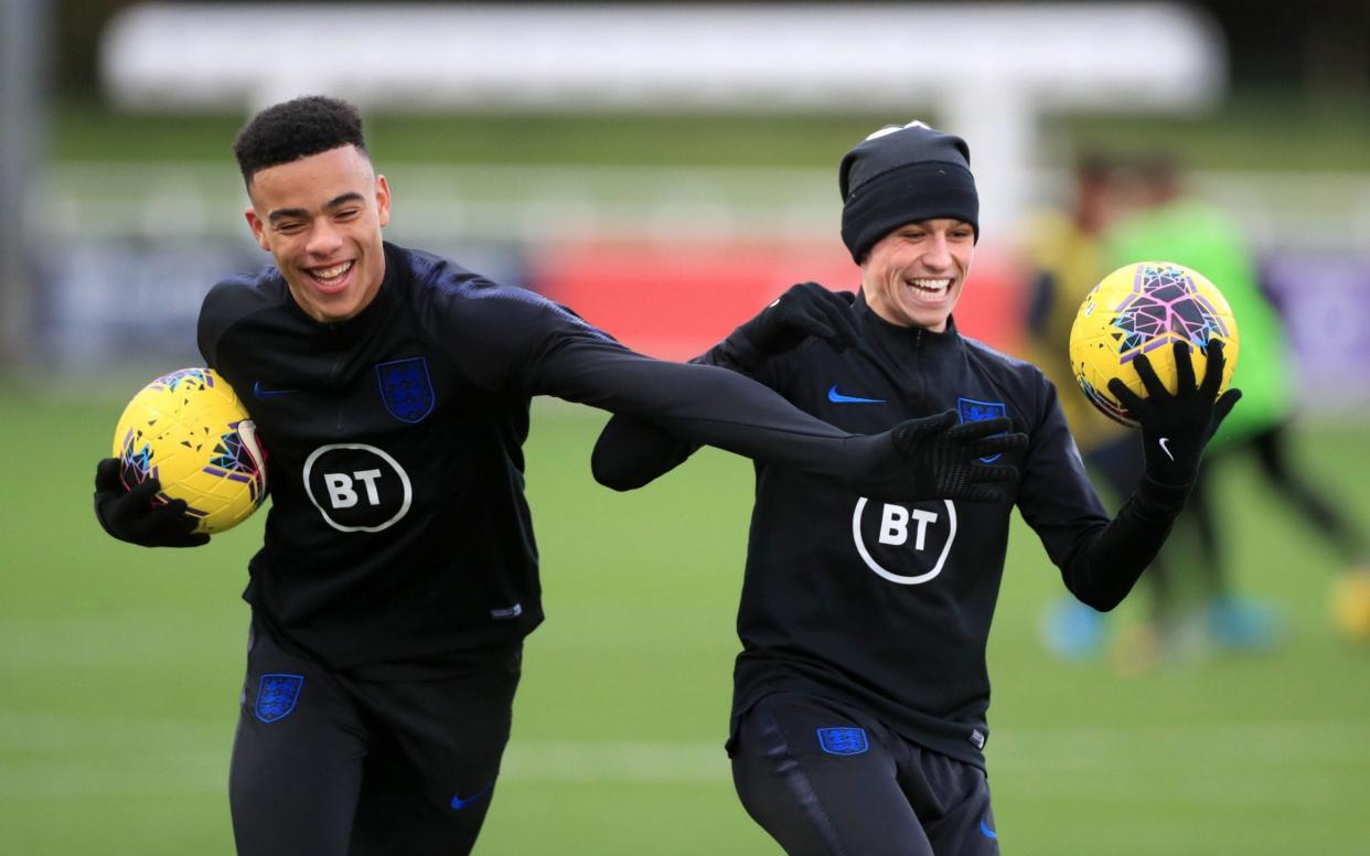  File photo dated 11-11-2019 of England's Mason Greenwood (left) and Phil Foden - PA/Mike Egerton 