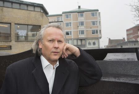 Swedish novelist and screenwriter Klas Ostergren poses for a photo in Lund February 28, 2014. Ostergren has been appointed a member of the Swedish Academy and will be formally installed on December 20, 2014. REUTERS/Drago Prvulovic/TT News Agency (SWEDEN - Tags: ENTERTAINMENT PROFILE SOCIETY) ATTENTION EDITORS - THIS IMAGE WAS PROVIDED BY A THIRD PARTY. THIS PICTURE IS DISTRIBUTED EXACTLY AS RECEIVED BY REUTERS, AS A SERVICE TO CLIENTS. NO COMMERCIAL SALES. SWEDEN OUT. NO COMMERCIAL OR EDITORIAL SALES IN SWEDEN. FOR EDITORIAL USE ONLY. NOT FOR SALE FOR MARKETING OR ADVERTISING CAMPAIGNS - GM1EA3101TT01