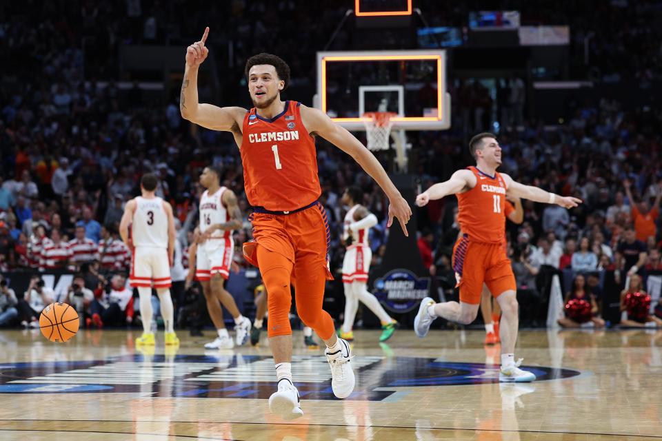 LOS ANGELES, CALIFORNIA - MARCH 28: Chase Hunter #1 of the Clemson Tigers celebrates with his teammate Joseph Girard III #11 after defeating the Arizona Wildcats during the second half in the Sweet 16 round of the NCAA Men's Basketball Tournament at Crypto.com Arena on March 28, 2024 in Los Angeles, California. The Clemson Tigers won, 77-72. (Photo by Harry How/Getty Images)