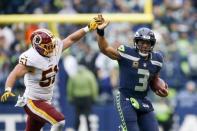 Nov 5, 2017; Seattle, WA, USA; Seattle Seahawks quarterback Russell Wilson (3) rushes against Washington Redskins inside linebacker Will Compton (51) during the third quarter at CenturyLink Field. Joe Nicholson-USA TODAY Sports