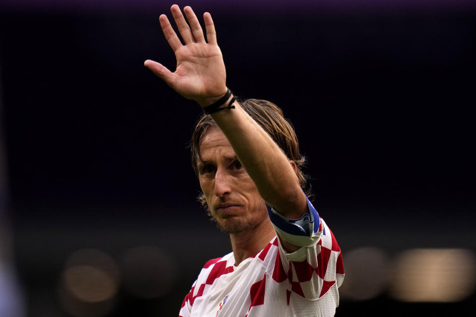 Croatia's Luka Modric waves to fans after the World Cup group F soccer match between Morocco and Croatia, at the Al Bayt Stadium in Al Khor , Qatar, Wednesday, Nov. 23, 2022. (AP Photo/Manu Fernandez)