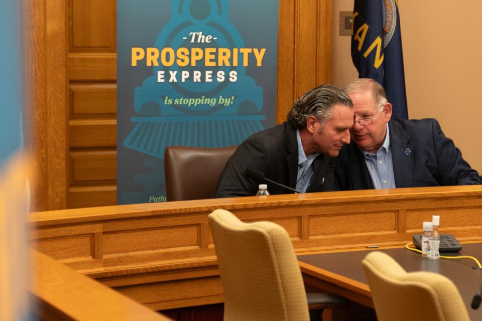 House Speaker Dan Hawkins, R-Wichita, right, chats with Senate President Ty Masterson, R-Andover, left, before a September tax cut campaign event at the Statehouse. Republicans this week sent a flat tax package to Gov. Laura Kelly for a likely veto.