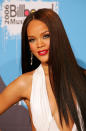 With a few hits under her belt, Rihanna changed up her look to a more sultry one, with bright red lipstick, sleek straight hair, and a plunging neckline. She walked away with two awards that year: Female Artist of the Year and Pop 100 Artist of the Year.