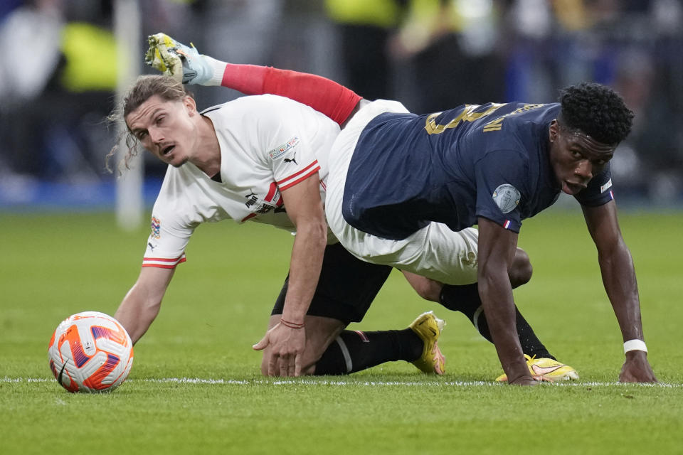 FILE - France's Aurelien Tchouameni, right, and Austria's Marcel Sabitzer vie for the ball during the UEFA Nations League soccer match between France and Austria at the Stade de France stadium in Saint Denis, outside Paris, France,Thursday, Sept. 22, 2022. (AP Photo/Christophe Ena, File)