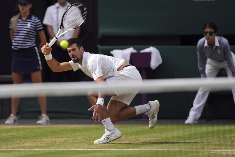 Serbia's Novak Djokovic in action against Spain's Carlos Alcaraz during the men's singles final on day fourteen of the Wimbledon tennis championships in London, Sunday, July 16, 2023. (AP Photo/Alberto Pezzali)