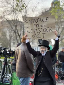  Molly Gaebe, a performer and activist with Abortion Access Front, dressed like 19th century anti-vice crusader Anthony Comstock, in front of the U.S. Supreme Court the day of oral arguments in the abortion-pill case, March 26, 2024. (Sofia Resnick | States Newsroom)