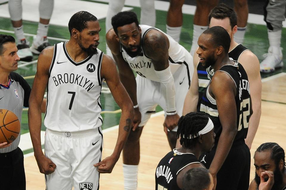 Brooklyn Nets forward Kevin Durant speaks with Milwaukee Bucks forward Khris Middleton after a hard foul on Thursday.