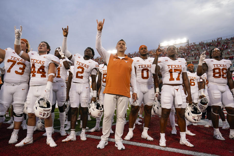 Texas head coach Steve Sarkisian, center, stands with his team after their win over Houston in an NCAA college football game, Saturday, Oct. 21, 2023, in Houston. (AP Photo/Eric Christian Smith)