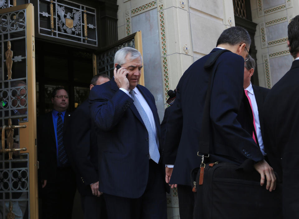 Robert K. Mericle leaves the William J. Nealon Federal Building and U.S. Courthouse in Scranton, Pa., after being sentenced to one year in prison on Friday, April 25, 2014. Mericle, a builder of for-profit youth detention centers, was sentenced for his role in a "kids for cash" scandal in which thousands of juveniles were sent to his facilities by judges who took money from him. He was also fined $250,000 and ordered to serve 100 hours of community service.(AP Photo/ The Times-Tribune, Jake Danna Stevens) WILKES BARRE TIMES-LEADER OUT; MANDATORY CREDIT