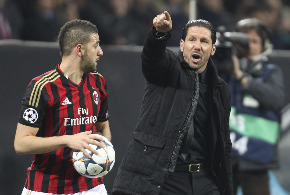 Atletico Madrid coach Diego Simeone, of Argentina, gestures during a Champions League, round of 16, first leg, soccer match between AC Milan and Atletico Madrid at the San Siro stadium in Milan, Italy, Wednesday, Feb. 19, 2014. (AP Photo/Antonio Calanni)