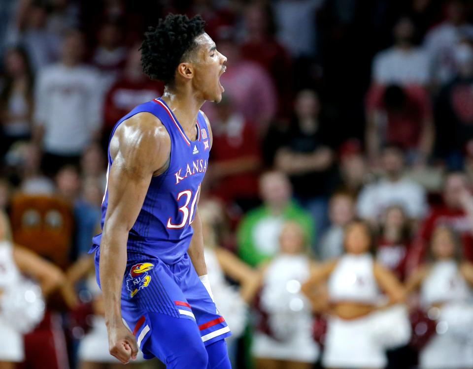 Kansas' Ochai Agbaji (30) reacts after a Jayhawk score during a 67-64 win against Oklahoma on Tuesday at Lloyd Noble Center in Norman.