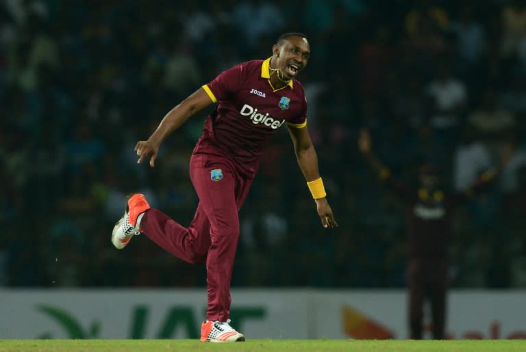 West Indies cricketer Dwayne Bravo celebrates during the second and final T20 International cricket match between Sri Lanka and the West Indies in Colombo on November 11, 2015