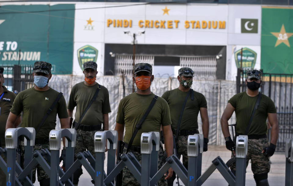 Pakistan paramilitary troops stand guard outside the Pindi Cricket Stadium following canceling of 1st one day international cricket match between Pakistan and New Zealand, in Rawalpindi, Pakistan, Friday, Sept. 17, 2021. New Zealand abandoned its cricket tour of Pakistan over security concerns that mystified the hosts, just before the Black Caps' first scheduled match in Pakistan in 18 years. (AP Photo/Anjum Naveed)