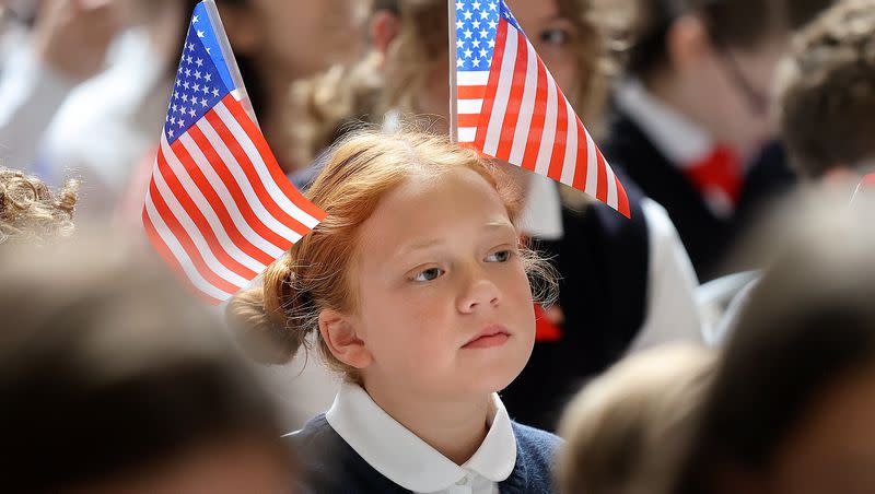 Portia Robinson wears American flags in her hair during the Constitution Month kickoff event at the Capitol in Salt Lake City on Thursday, Aug. 31, 2023.