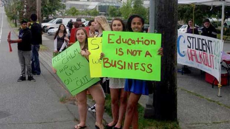 Students from Lord Tweedsmuir Secondary School rally to demand an end to the dispute between B.C. and teachers.