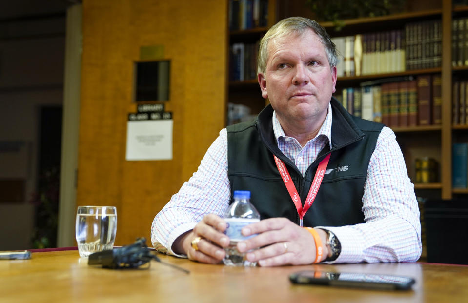 Norfolk Southern CEO Alan H. Shaw sits during an interview with local journalists at Centenary United Methodist Church on Thursday, March 16, 2023, in East Palestine, Ohio. (Pittsburgh Post-Gazette via AP)