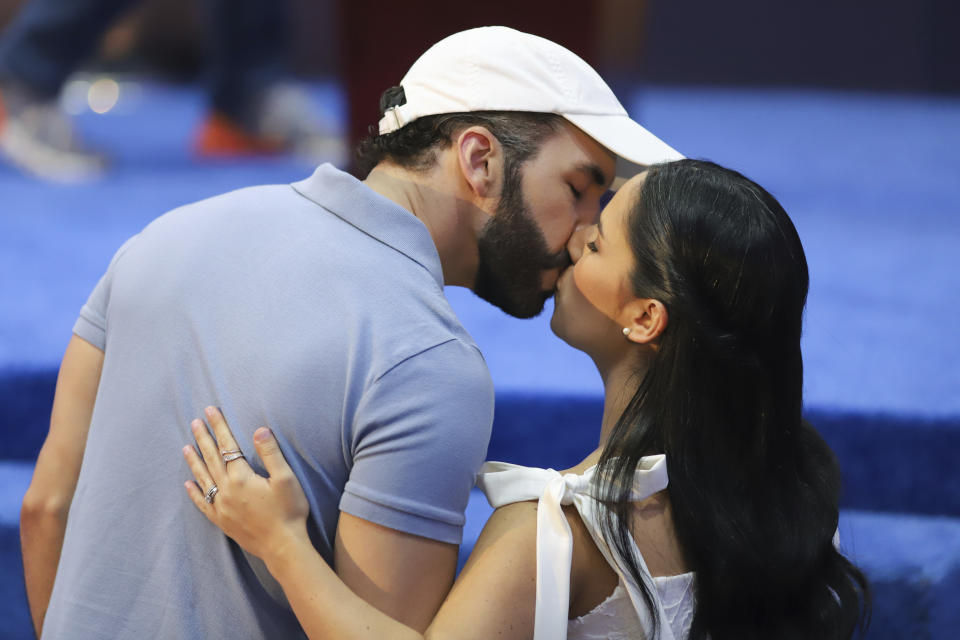 El Salvador President Nayib Bukele, who is seeking re-election, kisses his wife Gabriela Rodriguez prior to a press conference after voting in the general election in San Salvador, El Salvador, Sunday, Feb. 4, 2024. (AP Photo/Salvador Melendez)