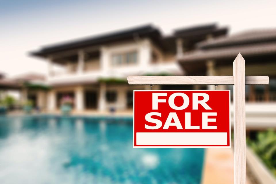 <span class="caption">Property values can be diminished by the threat of coastal flooding.</span> <span class="attribution"><a class="link " href="https://www.shutterstock.com/image-photo/sale-sign-luxury-house-pool-background-297849635" rel="nofollow noopener" target="_blank" data-ylk="slk:Shutterstock.com/Phonlamai Photo;elm:context_link;itc:0;sec:content-canvas">Shutterstock.com/Phonlamai Photo</a></span>