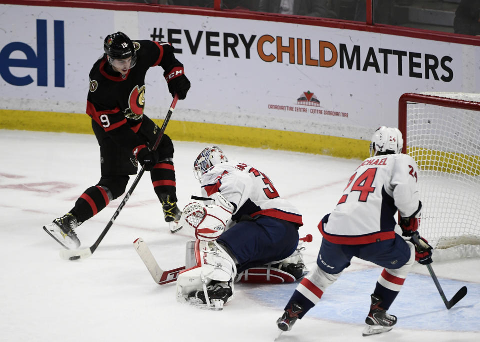 Ottawa Senators right wing Drake Batherson (19) shoots the puck for a goal against Washington Capitals goaltender Ilya Samsonov (30) during the second period of an NHL hockey game in Ottawa, Ontario, on Monday, Oct. 25, 2021. (Justin Tang/The Canadian Press via AP)