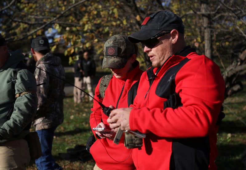 Militia members and pro-gun rights activists participating in the "Declaration of Restoration" rally prepare to march to Washington, D.C. from Arlington, Virginia