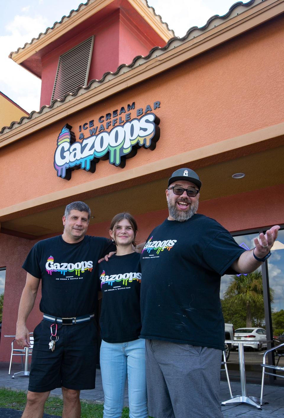 Mike LaVina, left, and Darren Hussien are co-owners of Gazoops Ice Cream and Waffle Bar in Cape Coral. Hussien's daughter Teegan Nichols, 12, poses with them.
