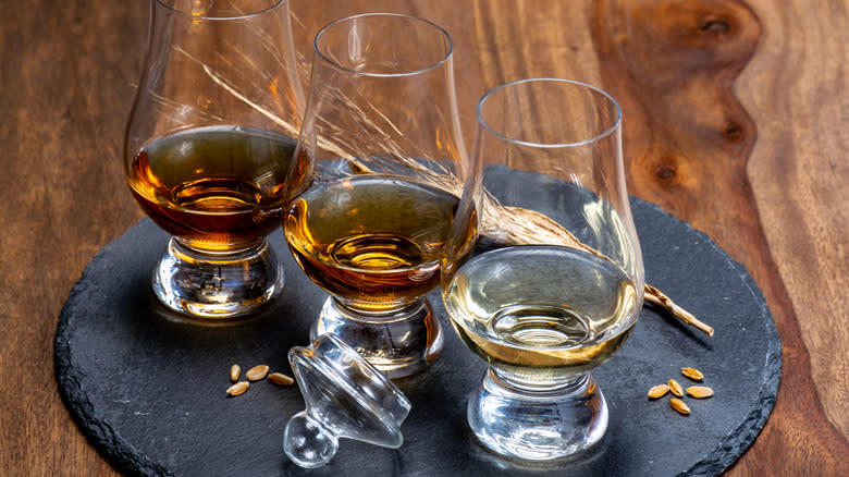Three glasses of different whiskeys