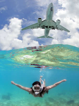 Amazing pics as jumbo jets photobomb tourists at tropical Caribbean resort