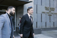 Elon Musk leaves the Phillip Burton Federal Building and United States Court House in San Francisco, Tuesday, Jan. 24, 2023. Musk returned to federal court to defend himself against a class-action lawsuit that alleges he misled Tesla shareholders with a tweet about an aborted buyout that the billionaire defiantly insisted Tuesday he could have pulled off, had he wanted. (AP Photo/ Benjamin Fanjoy)